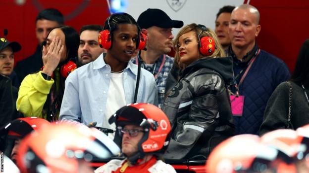 A$AP Rocky and Rihanna in the Ferrari garage chatting to each other