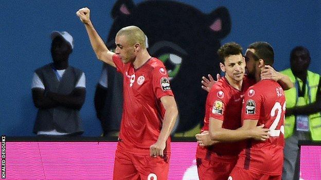 Tunisia's players celebrate after their opening goal