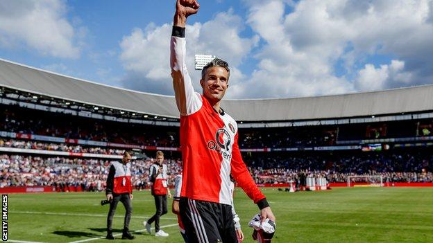 Robin van Persie salutes the Feyenoord fans following the final match of his 18-year career - a 2-0 defeat at home to Den Haag on 12 May in the Dutch Eredivisie