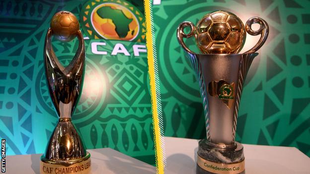The African Champions League (left) and Confederation Cup trophies