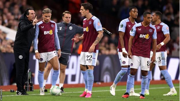 Aston Villa players receive instructions from Unai Emery