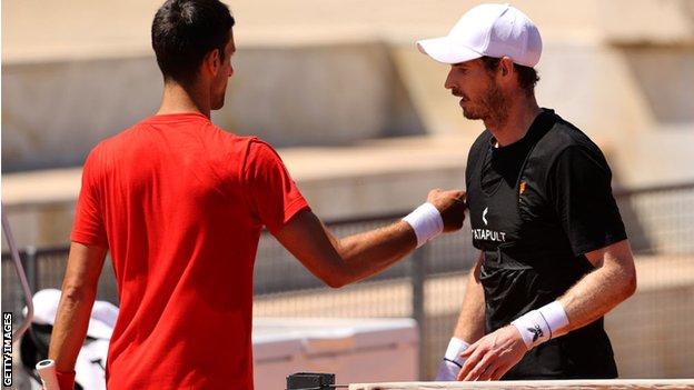 Andy Murray and Novak Djokovic at the net