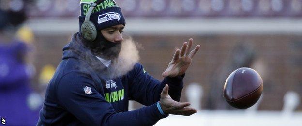 Seattle quarterback Russell Wilson warms up