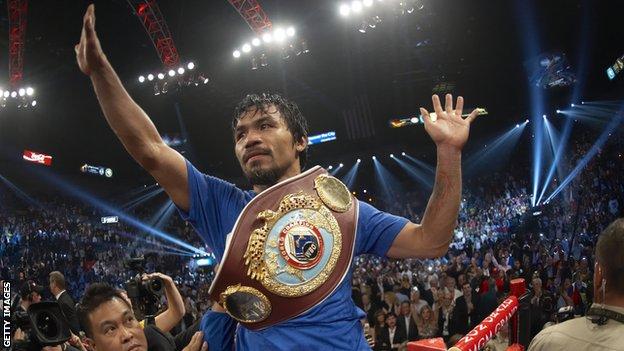 Manny Pacquiao celebrating with the WBO Welterweight belt after beating Shane Mosley in 2011