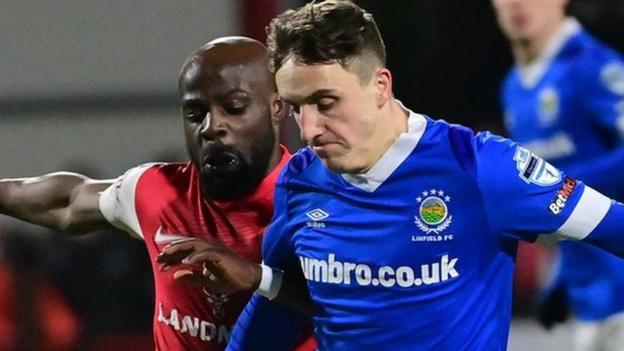 Larne's Fuad Sule and Linfield's Joel Cooper