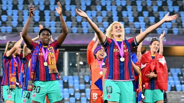 Asisat Oshoala (left) and France's Kheira Hamraoui celebrate Barcelona winning the European Women's Champions League