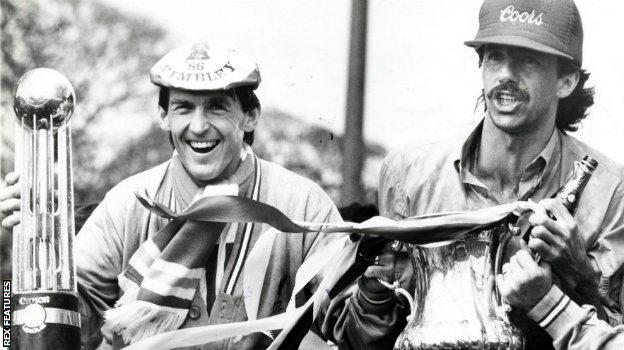 Liverpool player-manager Kenny Dalglish and Mark Lawrenson celebrate the Reds' league and FA Cup double in 1986