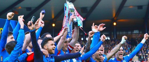 Rangers players celebrating with the Scottish Challenge Cup trophy