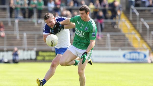 Dermot Malone of Monaghan and Fermanagh's Mickey Jones keep their eyes on the ball as the Farney County book a place in the 19 July final