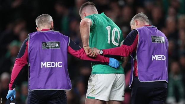 Johnny Sexton is helped off in the closing stages of Ireland's win over England last weekend
