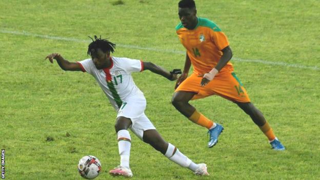 Torino's Wilfried Singo (right) in action for Ivory Coast against Zakaria Sanogo and Burkina Faso in June 2021