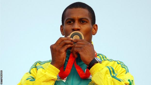Togolese canoeist Benjamin Boukpeti kisses the bronze medal he won at the 2008 Beijing Olympics