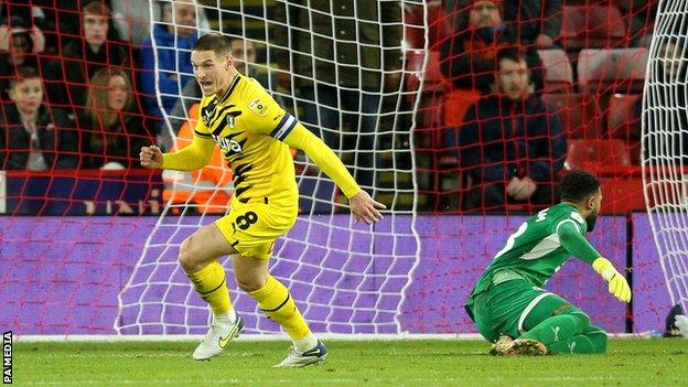 Ben Wiles celebrates his goal for Rotherham against Sheffield United