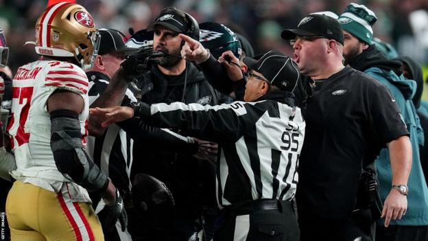 Dre Greenlaw argues with Eagles head coach Nick Siriani and security chief Dom DiSandro