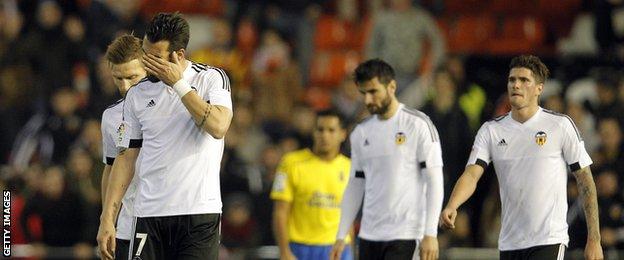 Valencia players look disheartened after another loss