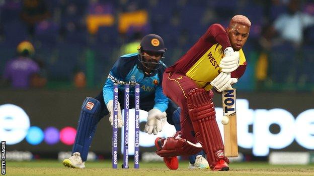 Shimron Hetmyer of West Indies plays a shot as Kusal Perera of Sri Lanka looks on