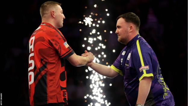 darts stars Nathan Aspinall (left) and Luke Littler