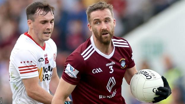 Westmeath's Kevin Maguire attempts to get away from Tyrone's Darragh Canavan