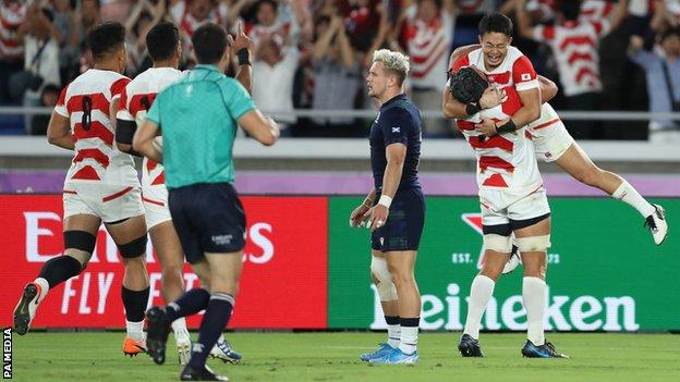 Japan celebrate their win over Scotland
