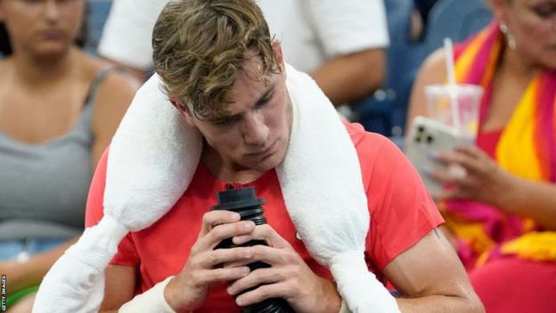 Jack Draper cools himself during a changeover in his US Open match against Andrey Rublev