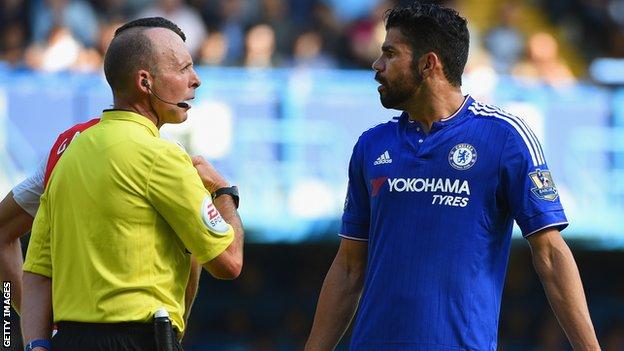 Mike Dean speaks to Diego Costa