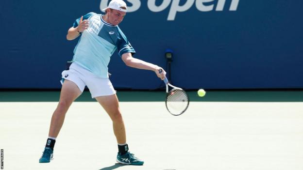 Dominic Stephan Stricker takes a changeable  during his US Open second-round match