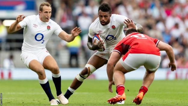 Courtney Lawes carries the ball for England