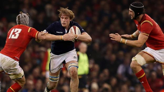 Jonathan Davies (left) and Luke Charteris (right) tackle Scotland's Jonny Gray