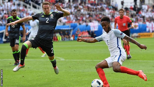Chris Gunter moves to tackle Raheem Sterling at Euro 2016