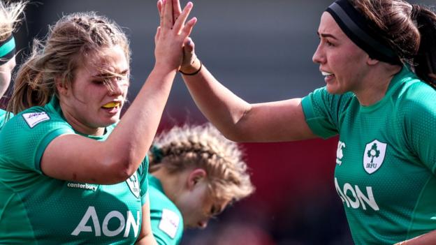 Dorothy Wall and Nicola Fryday celebrate a turnover