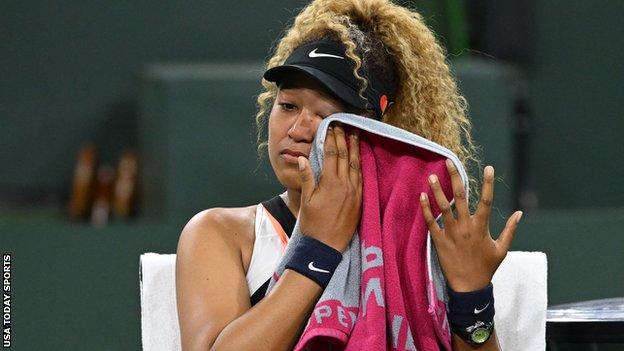 Naomi Osaka reacts after being heckled