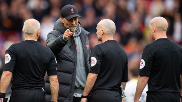 Jurgen Klopp speaks to the officials aft  Liverpool's triumph   implicit    Tottenham