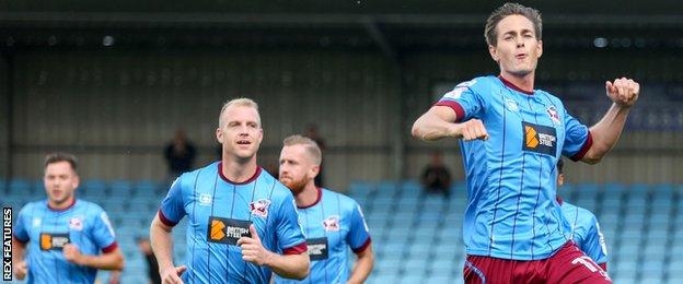 Josh Morris (right) celebrates a goal against Gillingham