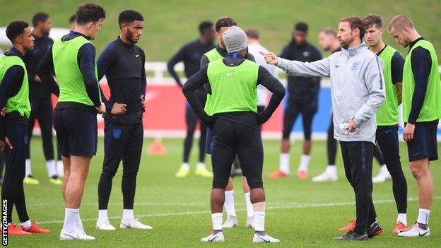 Gareth Southgate (right) directs players during England training