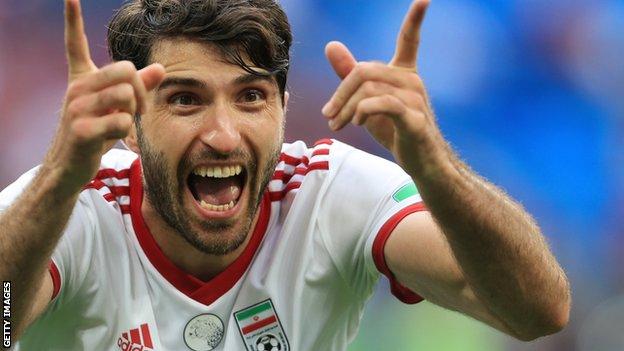 Karim Ansarifard celebrates a World Cup goal for Iran