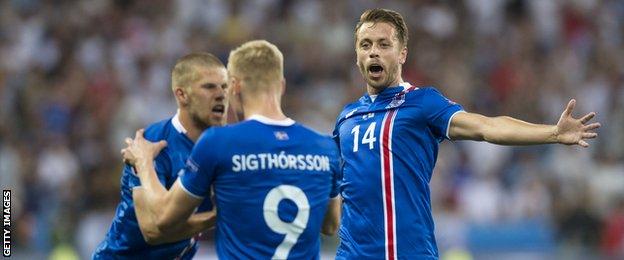 Kari Arnason (right) celebrates a goal for Iceland