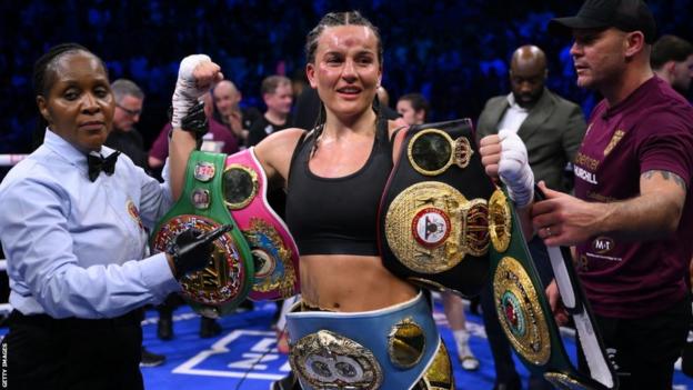 Chantelle Cameron celebrates with her belts