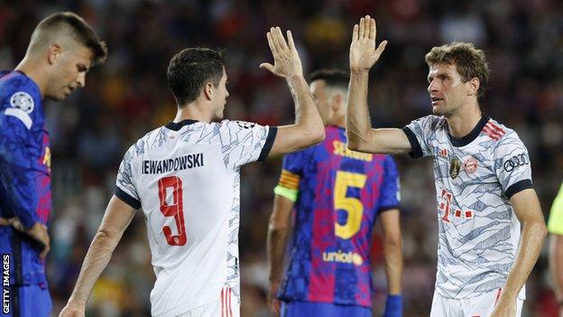 Thomas Muller (right) celebrates his goal for Bayern Munich at Barcelona