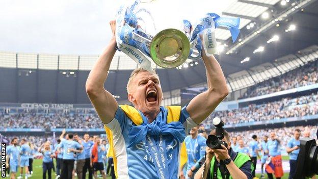 Oleksandr Zinchenko lifts the Premier League trophy