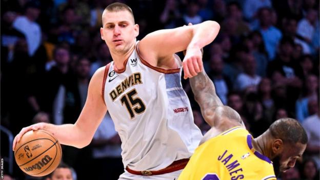 Nikola Jokic holds disconnected  LeBron James