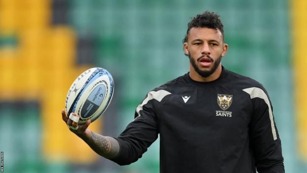 Courtney Lawes holds the ball as he warms up for Northampton Saints