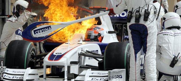 Flames escape from the BMW Sauber of Robert Kubica during the Bahrain Grand Prix in 2009