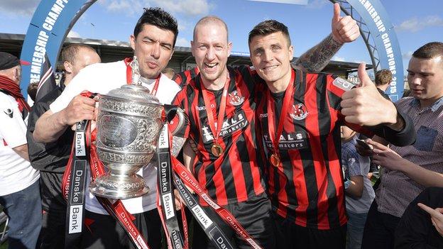 Crusaders players celebrate their Premiership triumph at the end of April