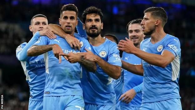 Manchester City's players celebrate scoring against RB Leipzig in the Champions League