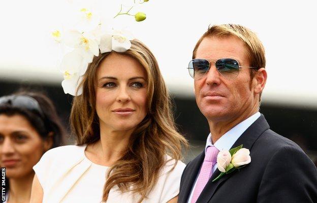 Shane Warne and Elizabeth Hurley attend the presentation of the Crown Oaks during Crown Oaks Day at Flemington Racecourse on November 3, 2011