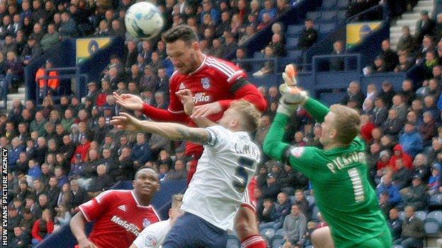 Sean Morrison of Cardiff goes close with a header