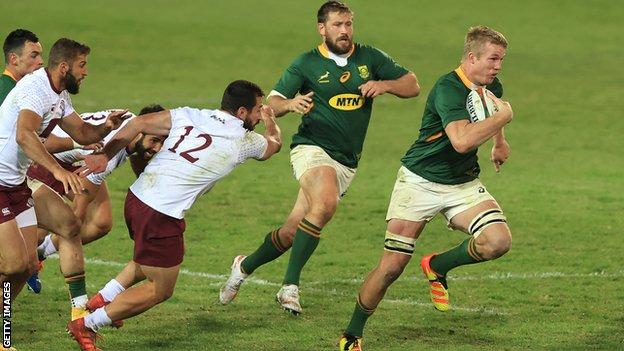 South Africa's Pieter-Steph du Toit runs with the ball