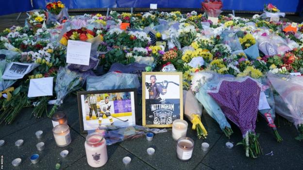Floral tributes left outside Nottingham's Motorpoint Arena following the death of Adam Johnson
