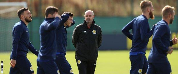 Scotland manager Steve Clarke watches his players at training