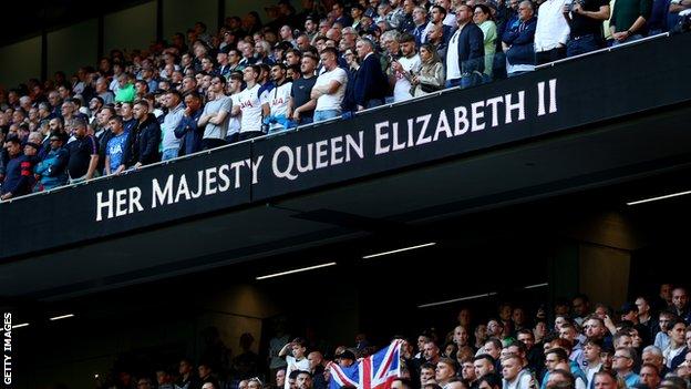 Tottenham fans observe a minute's silence